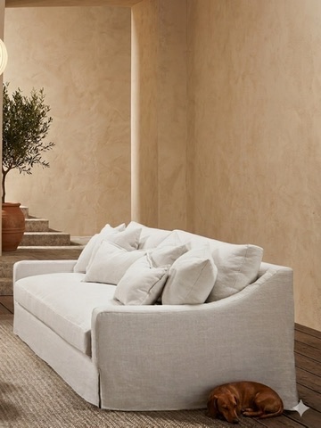 Sofa in a plastered interior